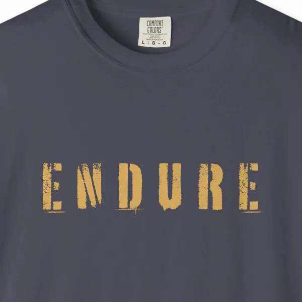 Close-up of the Endure print on a Navy Comfort Colors 1717 tee