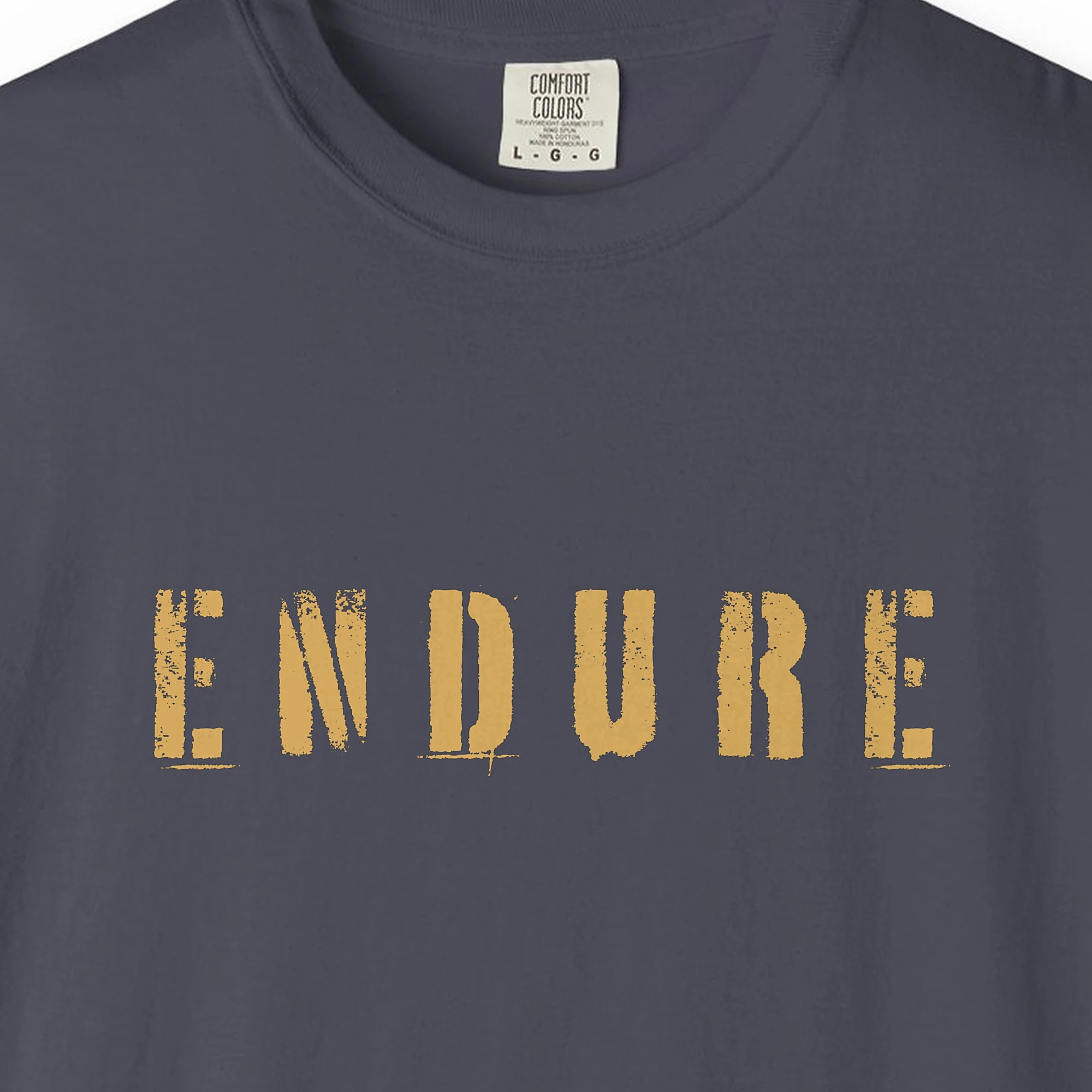 Close-up of the Endure print on a Navy Comfort Colors 1717 tee