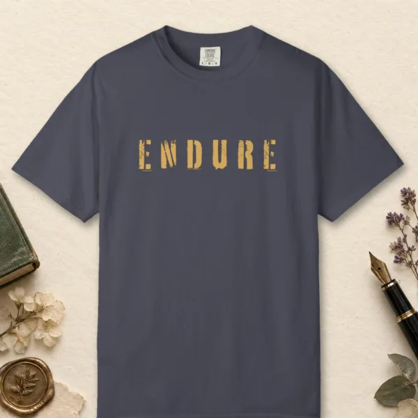 Endure design on a Navy Comfort Colors 1717 tee, laid flat