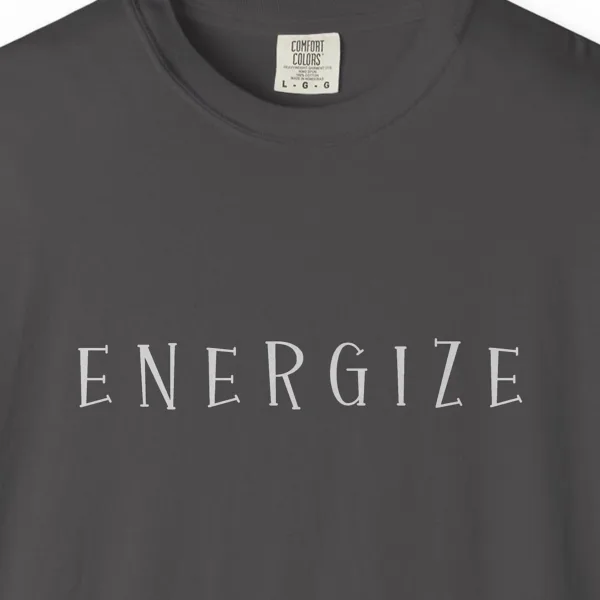 energize-flared-capitals-tee-graphite-chest Close-up of the Energize Flared Capitals print on a Graphite Comfort Colors 1717 tee