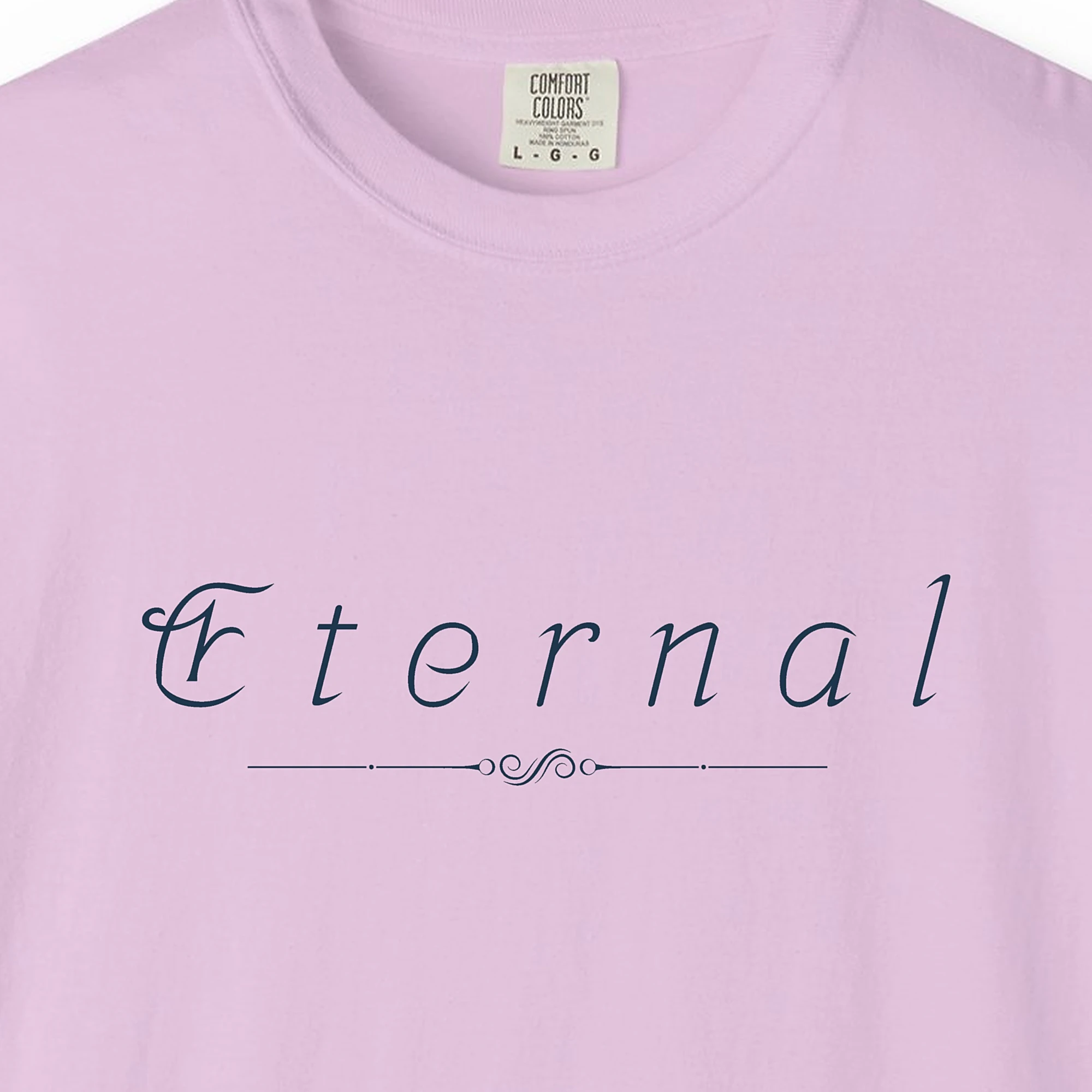 Close-up of the Eternal Swirl print on a Orchid Comfort Colors 1717 tee