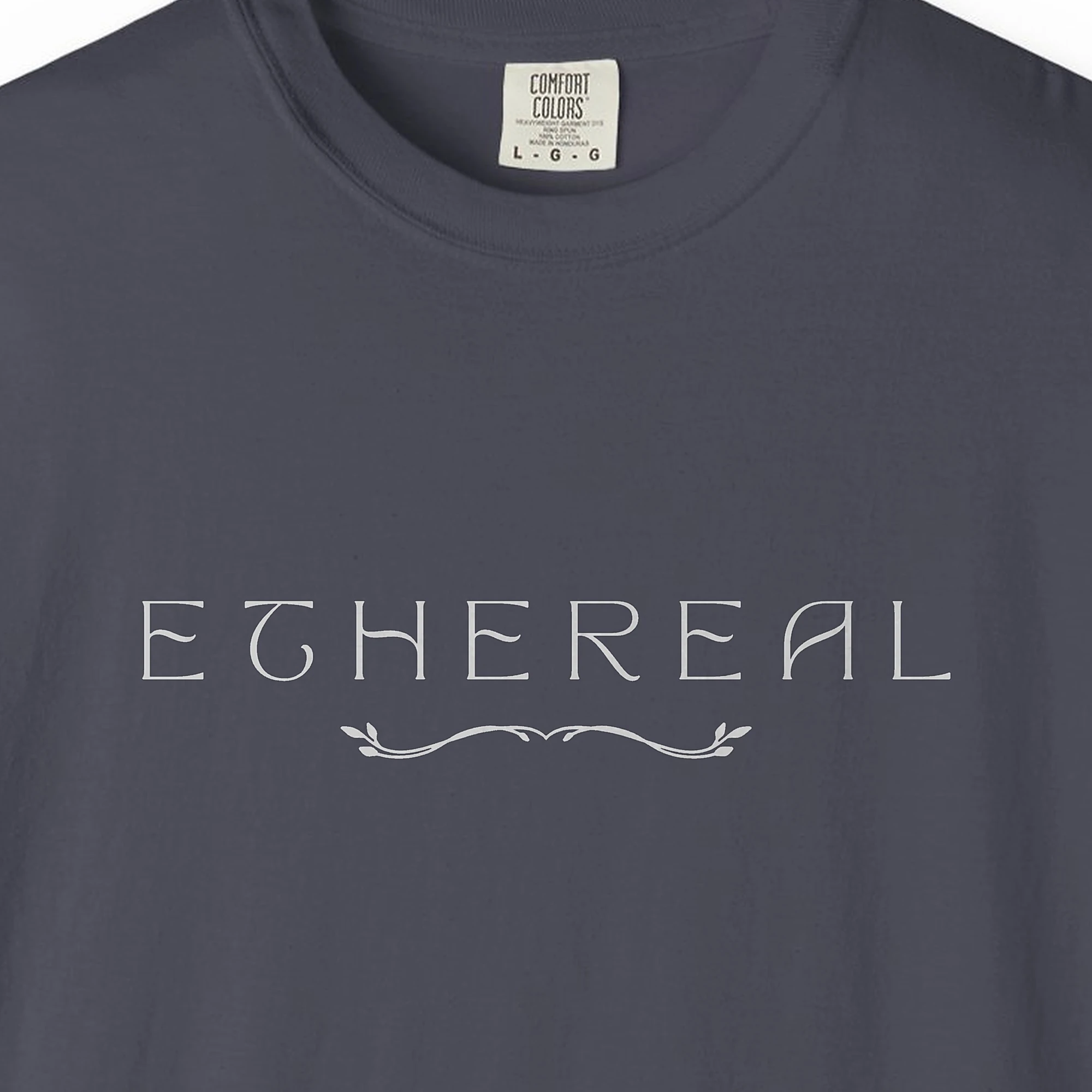 Close-up of the Ethereal Leaf Vine print on a Navy Comfort Colors 1717 tee