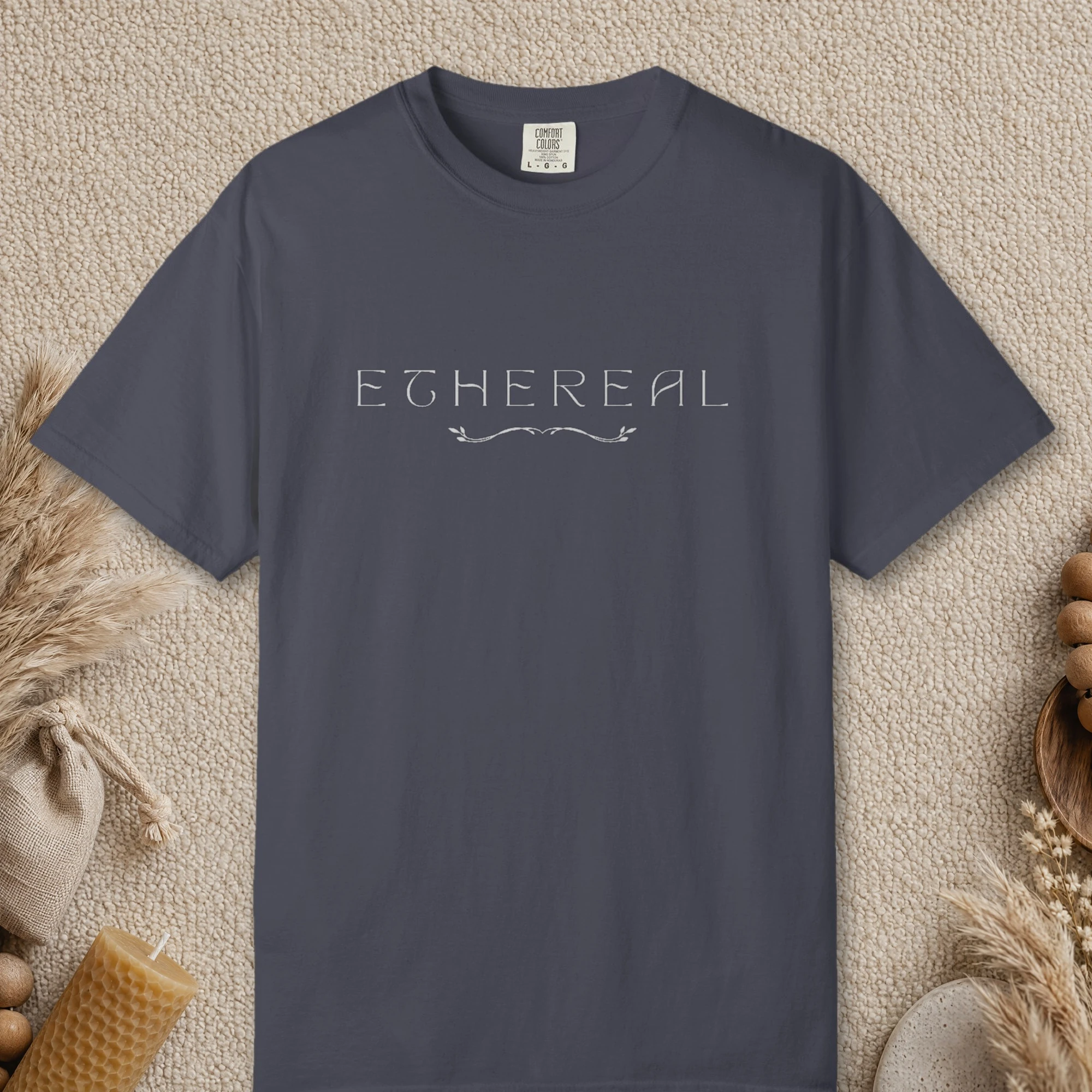 Ethereal Leaf Vine design on a Navy Comfort Colors 1717 tee, laid flat