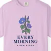 Close-up of the Every Morning a New Bloom print on a Orchid Comfort Colors 1717 tee