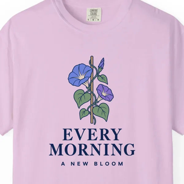 Close-up of the Every Morning a New Bloom print on a Orchid Comfort Colors 1717 tee