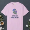 Every Morning a New Bloom design on a Orchid Comfort Colors 1717 tee, laid flat