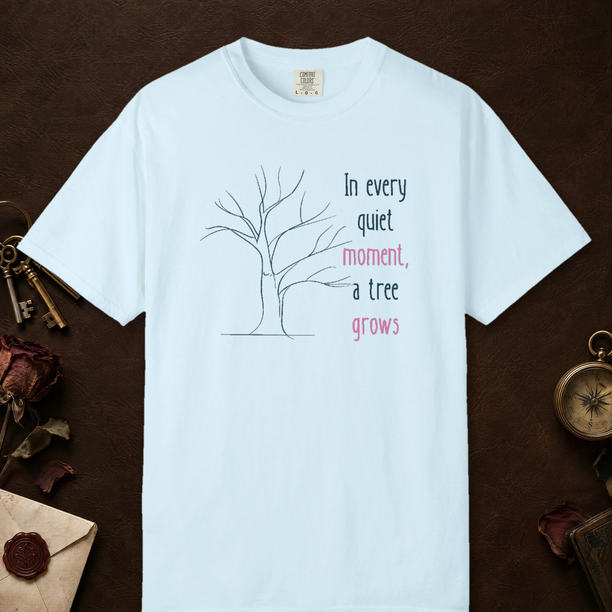 Every Quiet Moment design on a Chambray Comfort Colors 1717 tee, laid flat