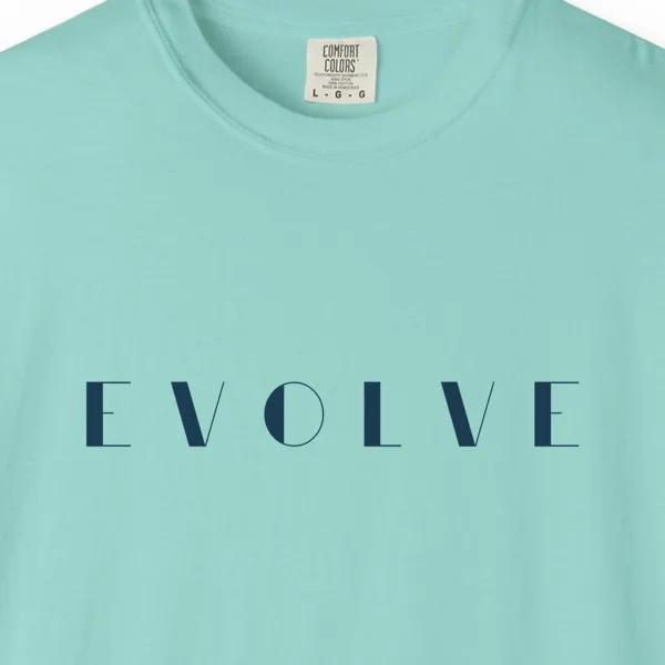 Close-up of the Evolve Art Deco print on a Chalky Mint Comfort Colors 1717 tee