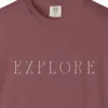 Close-up of the Explore Roman Capitals print on a Brick Comfort Colors 1717 tee