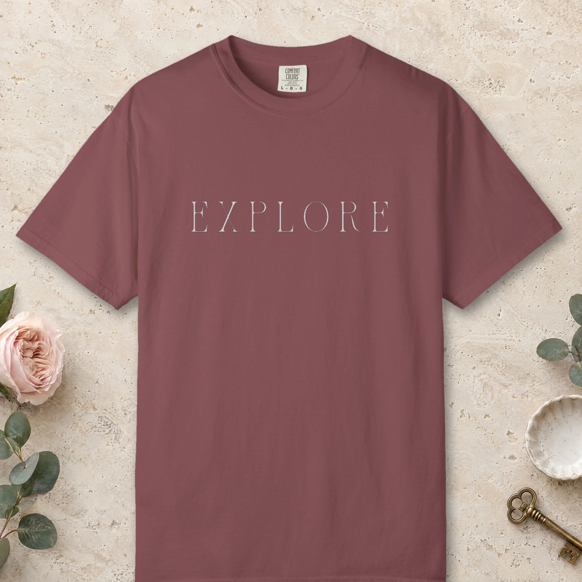 Explore Roman Capitals design on a Brick Comfort Colors 1717 tee, laid flat