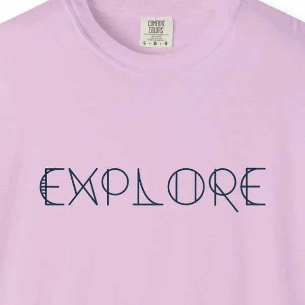 explore-tee-orchid-chest Close-up of the Explore print on a Orchid Comfort Colors 1717 tee