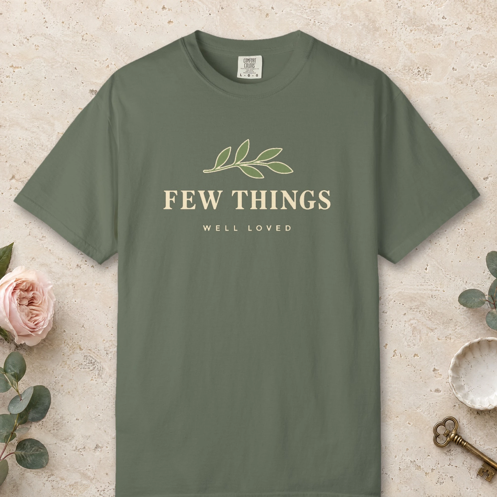 Few Things Well Loved design on a Moss Comfort Colors 1717 tee, laid flat