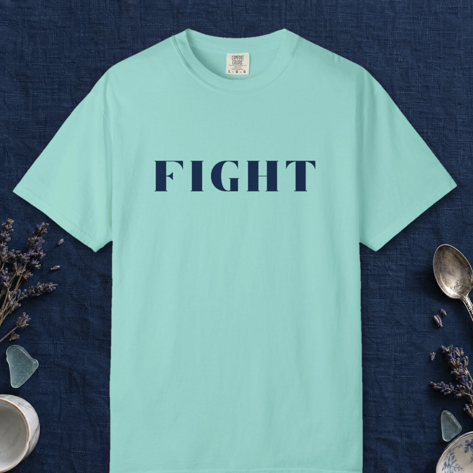 Fight design on a Chalky Mint Comfort Colors 1717 tee, laid flat