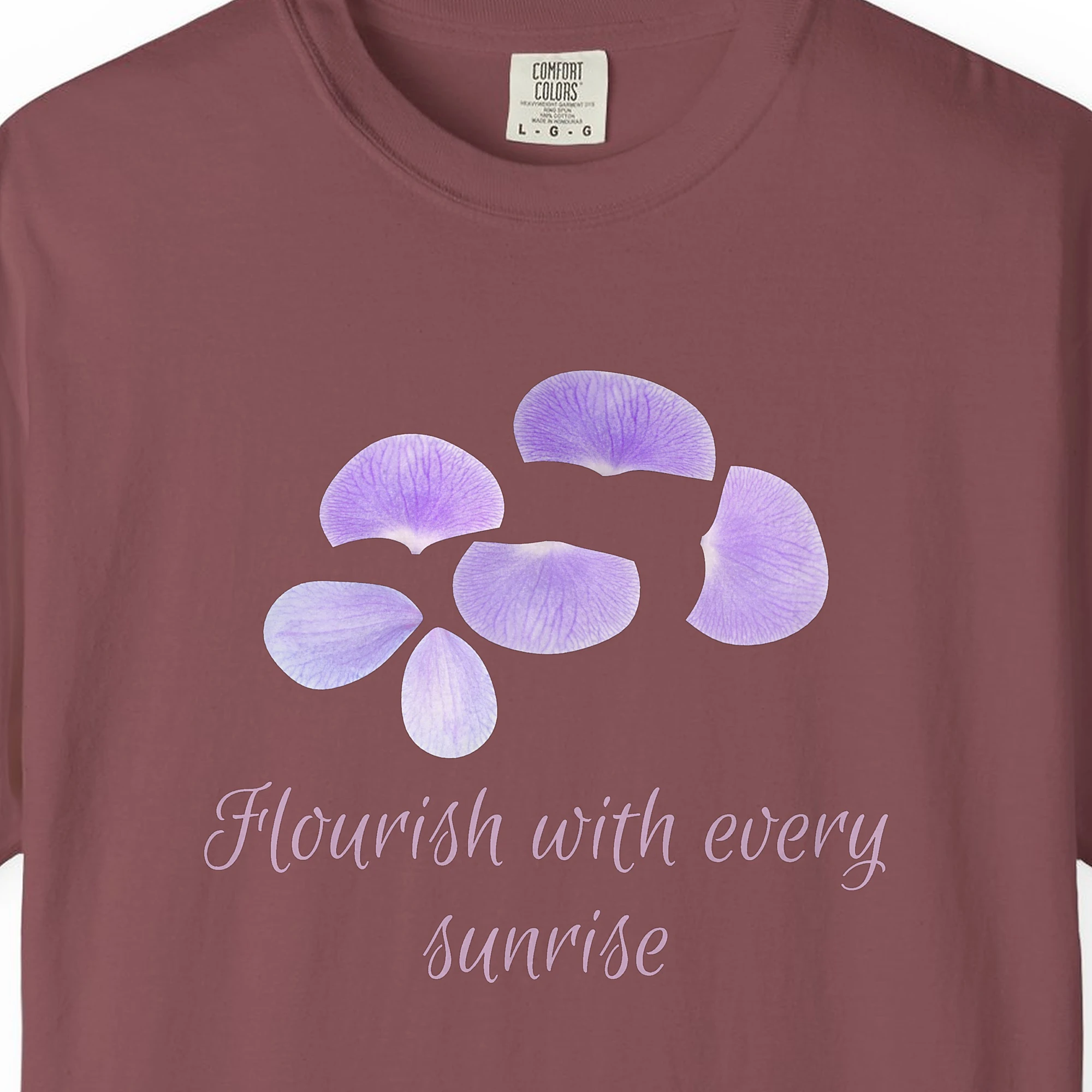 Close-up of the Flourish with Every Sunrise print on a Brick Comfort Colors 1717 tee