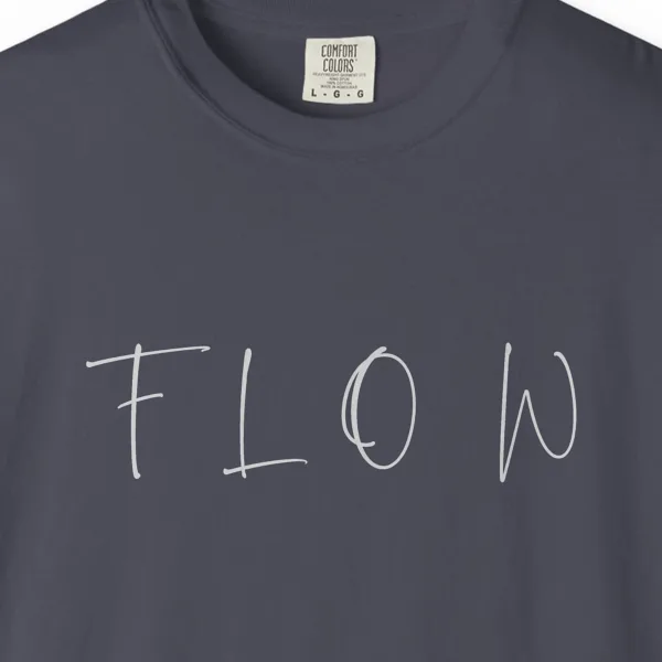 Close-up of the Flow Brush Capitals print on a Navy Comfort Colors 1717 tee