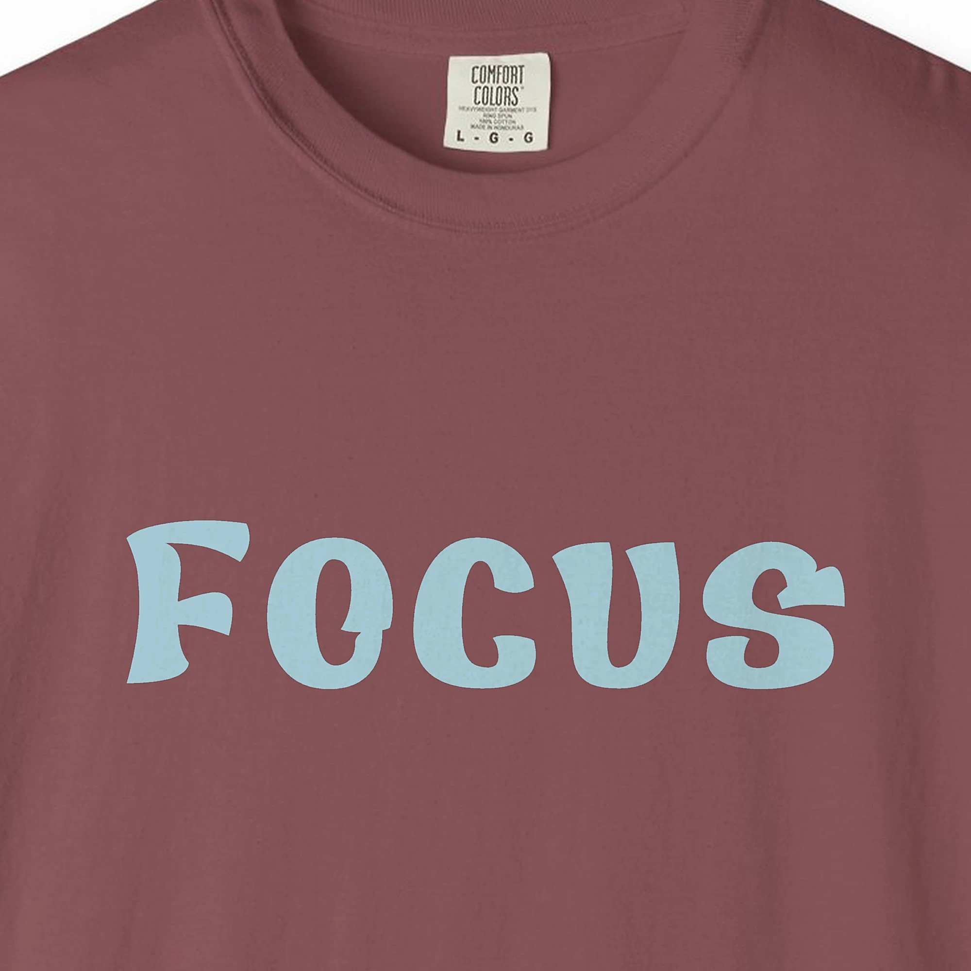 focus-tee-brick-chest Close-up of the Focus print on a Brick Comfort Colors 1717 tee