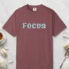 Focus design on a Brick Comfort Colors 1717 tee, laid flat