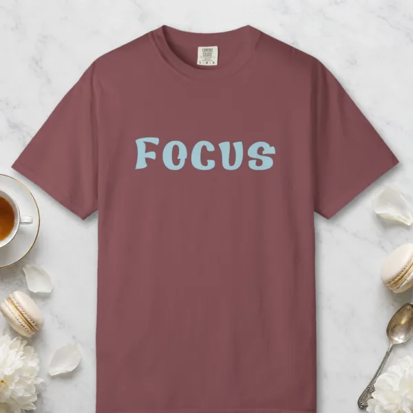 Focus design on a Brick Comfort Colors 1717 tee, laid flat