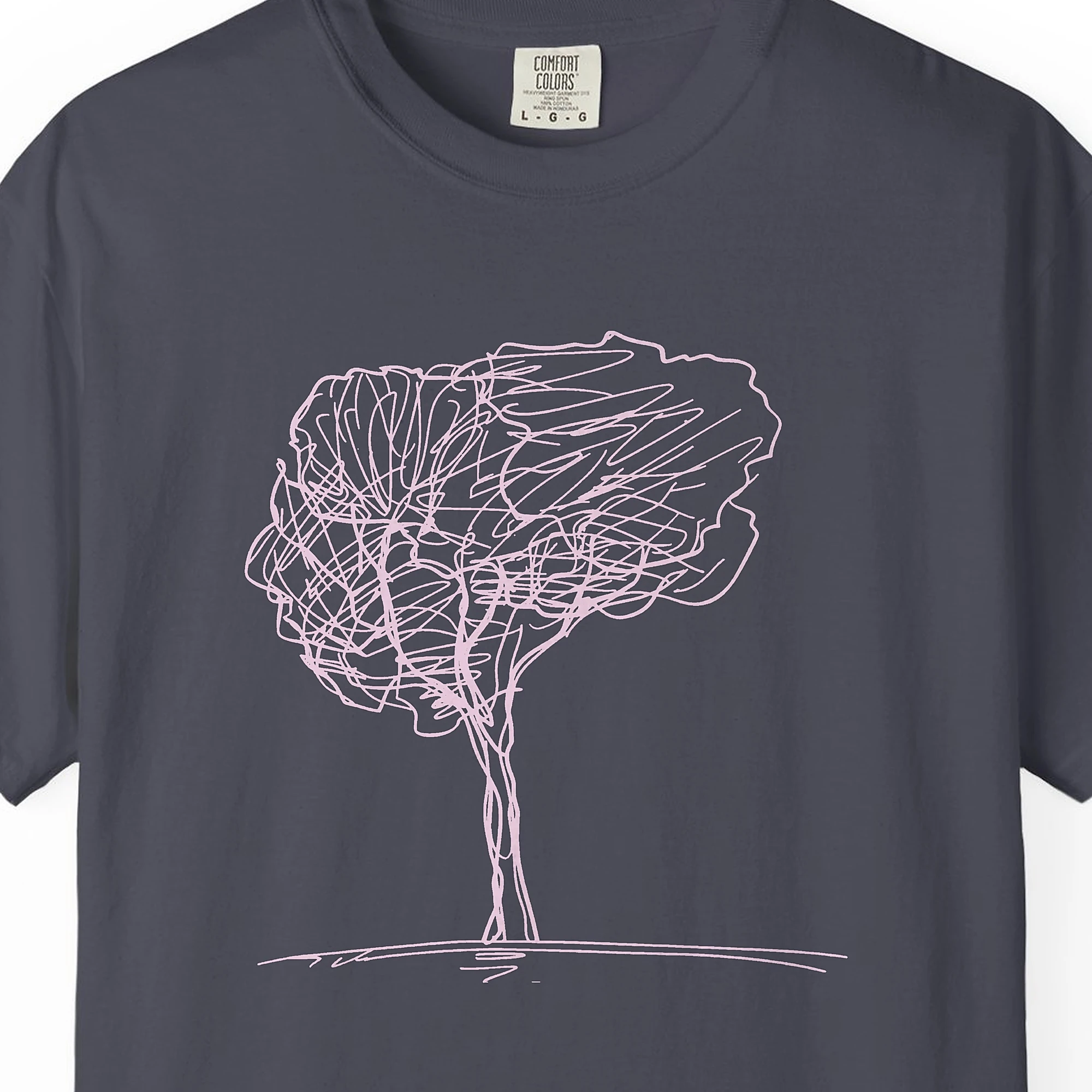 Close-up of the Full Crown Tree print on a Navy Comfort Colors 1717 tee