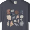 Close-up of the Gathered Seashells print on a Navy Comfort Colors 1717 tee
