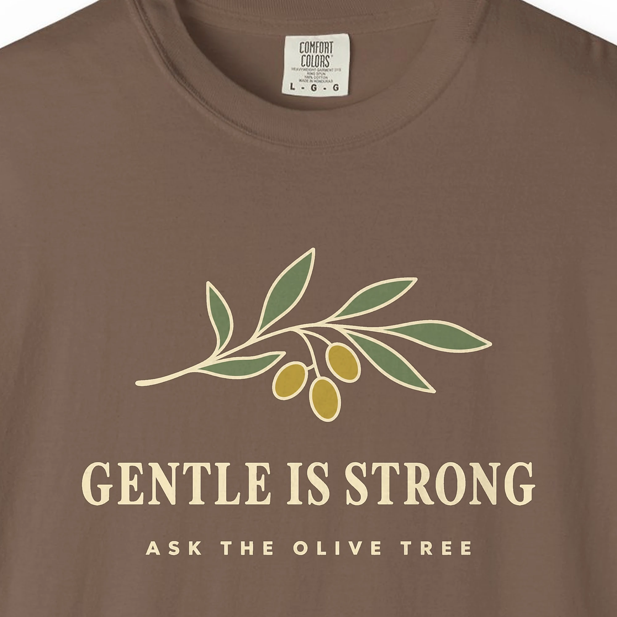 gentle-is-strong-tee-espresso-chest Close-up of the Gentle Is Strong print on a Espresso Comfort Colors 1717 tee