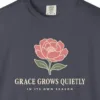 Close-up of the Grace Grows Quietly print on a Navy Comfort Colors 1717 tee