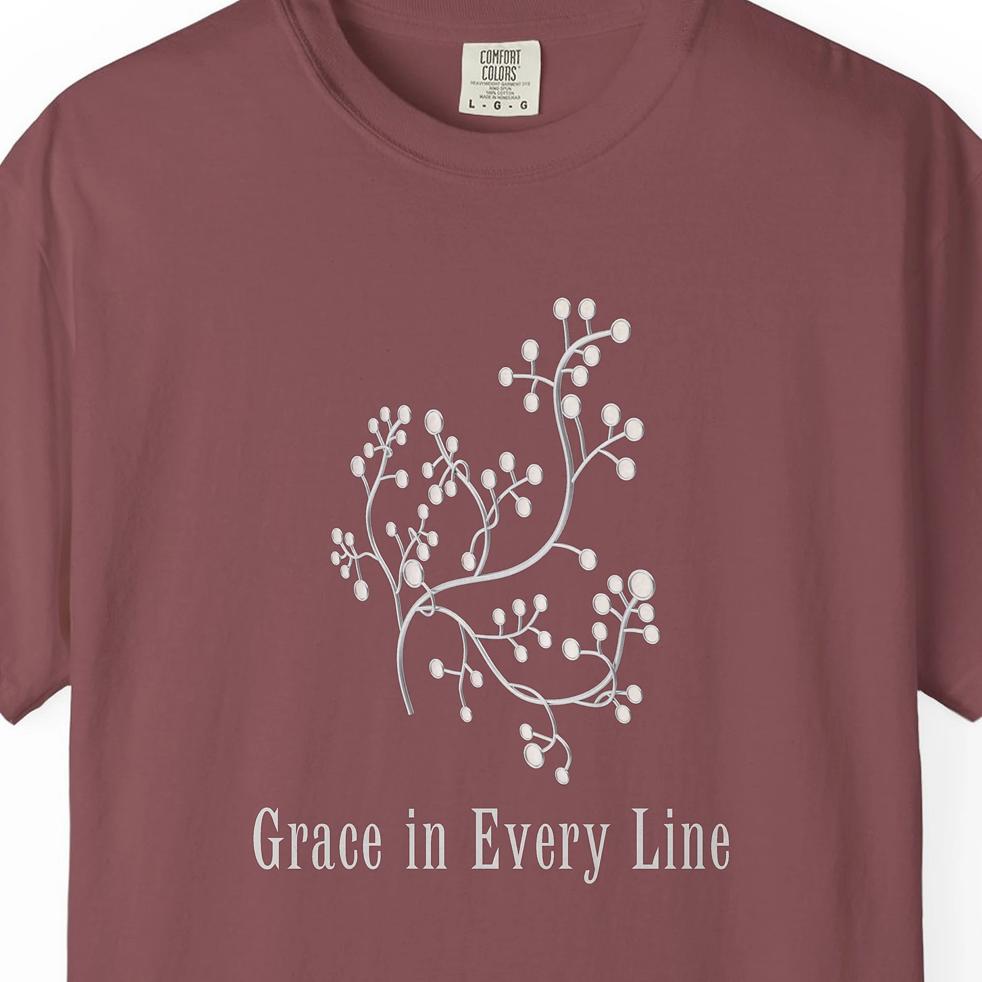 Close-up of the Grace in Every Line print on a Brick Comfort Colors 1717 tee
