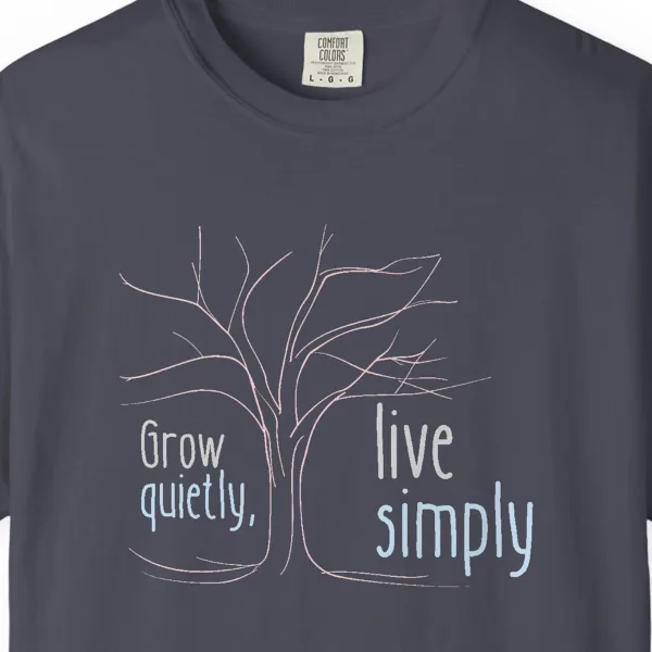 Close-up of the Grow Quietly Live Simply print on a Navy Comfort Colors 1717 tee