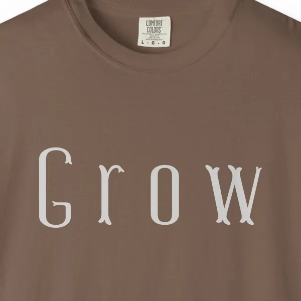 grow-tall-letter-tee-espresso-chest Close-up of the Grow Tall Letter print on a Espresso Comfort Colors 1717 tee