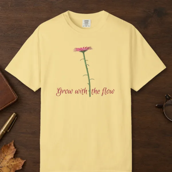 Grow with the Flow design on a Butter Comfort Colors 1717 tee, laid flat