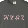 Close-up of the Heal print on a Pepper Comfort Colors 1717 tee