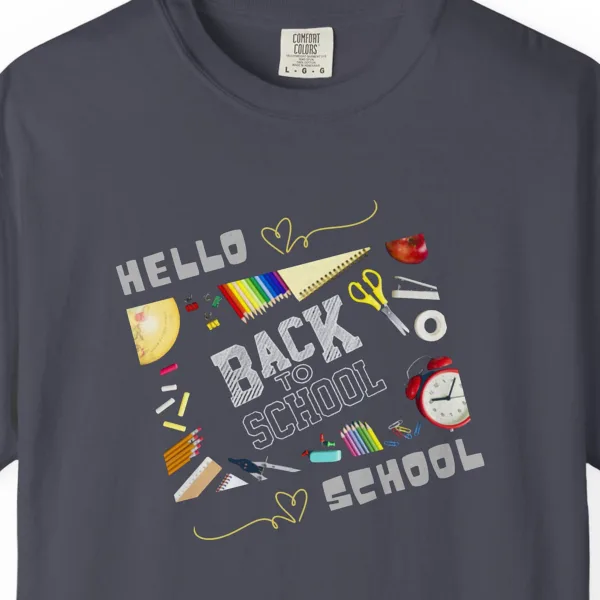 Close-up of the Hello School Supplies print on a Navy Comfort Colors 1717 tee
