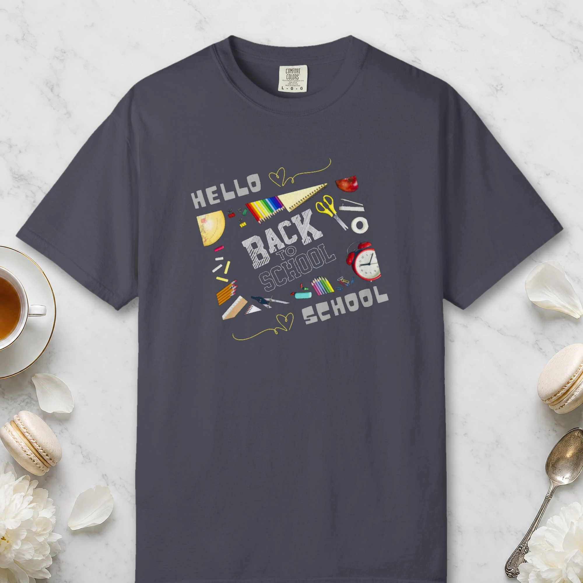 Hello School Supplies design on a Navy Comfort Colors 1717 tee, laid flat