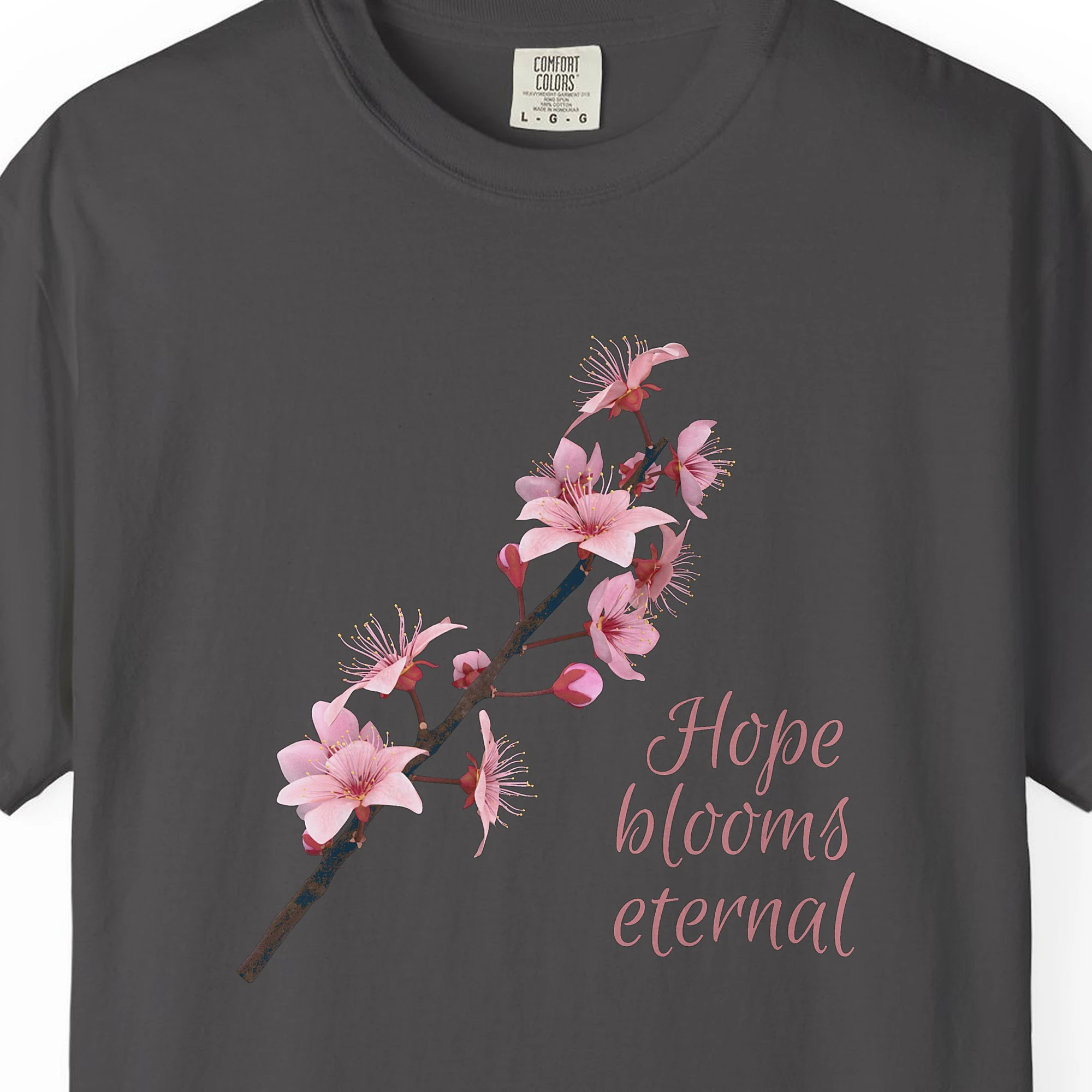 Close-up of the Hope Blooms Eternal print on a Graphite Comfort Colors 1717 tee