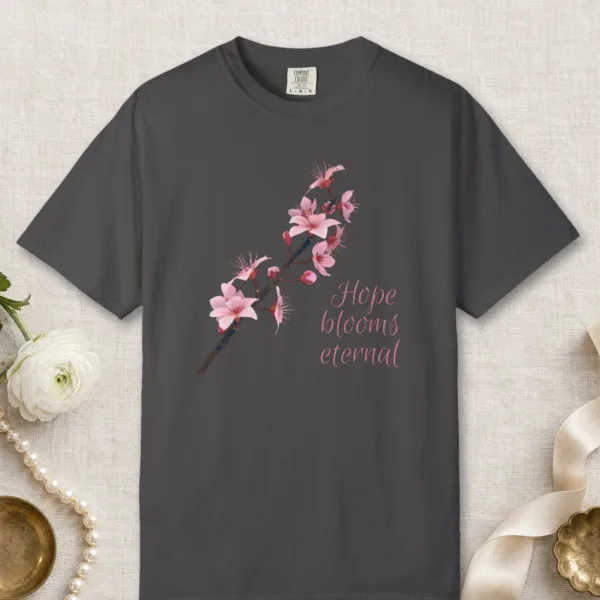 Hope Blooms Eternal design on a Graphite Comfort Colors 1717 tee, laid flat