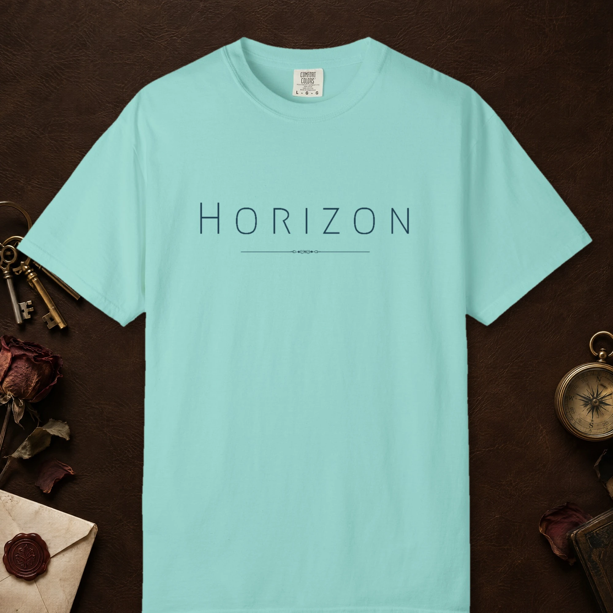 Horizon Line design on a Chalky Mint Comfort Colors 1717 tee, laid flat