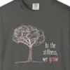 in-the-stillness-we-grow-tee-pepper-chest Close-up of the In the Stillness We Grow print on a Pepper Comfort Colors 1717 tee