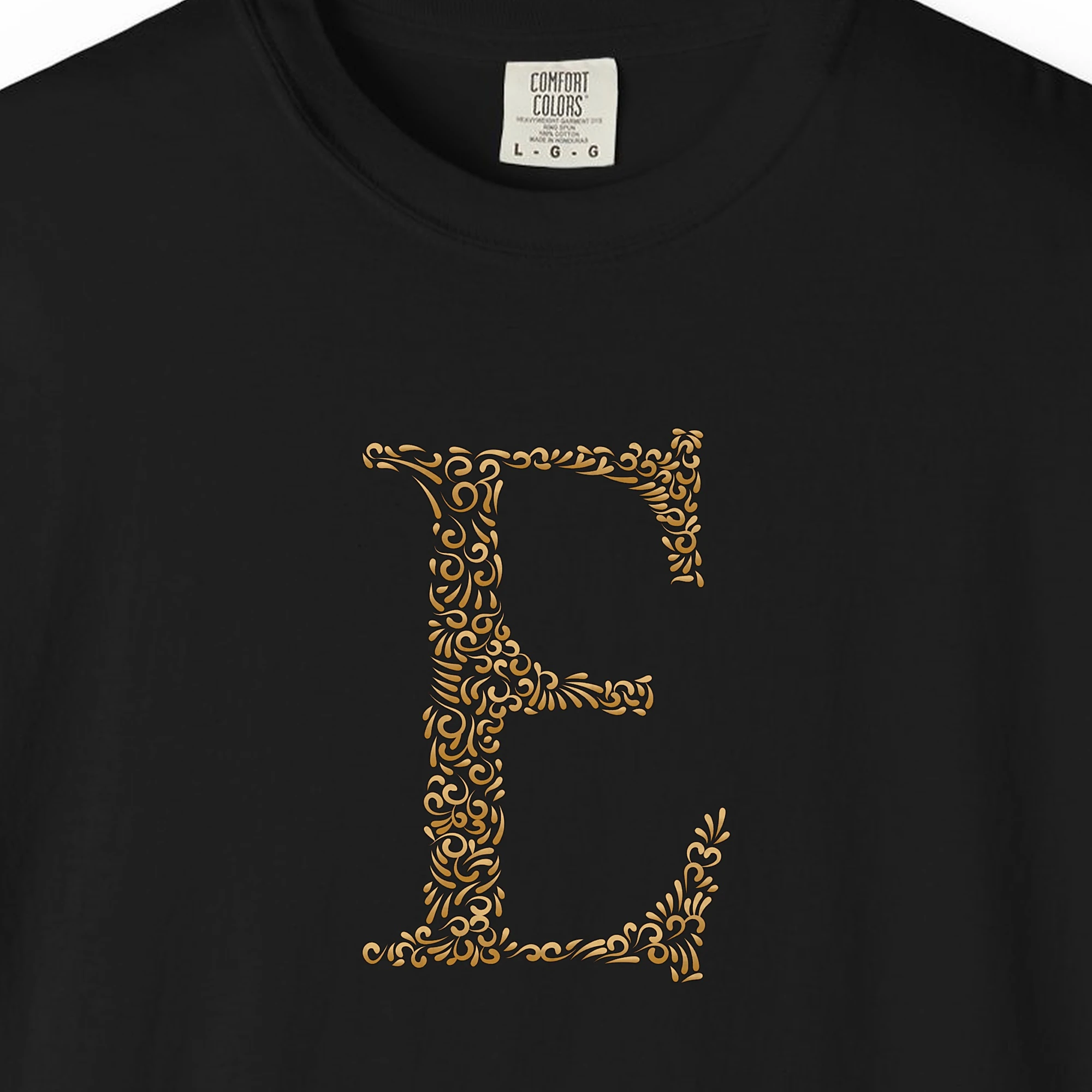 Close-up of the Initial E print on a Black Comfort Colors 1717 tee