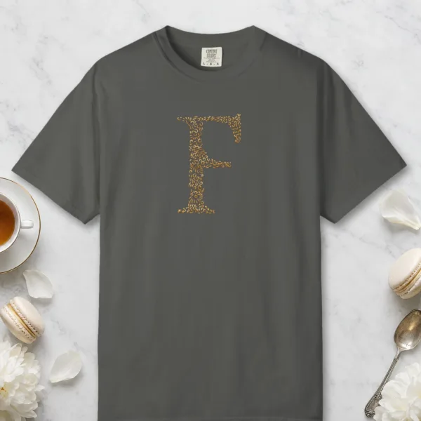 Initial F design on a Pepper Comfort Colors 1717 tee, laid flat
