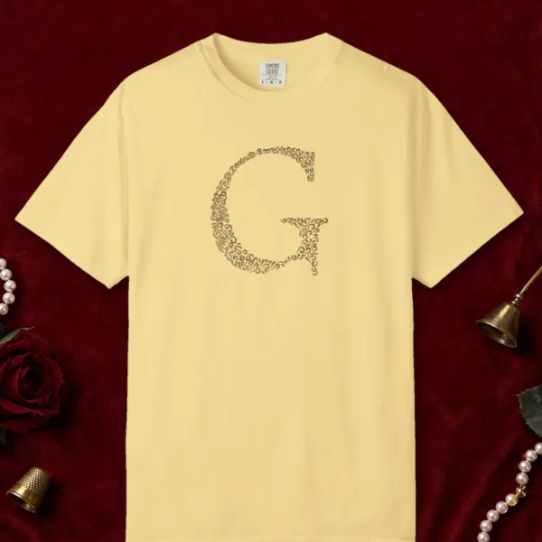 initial-g-tee-butter-front Initial G design on a Butter Comfort Colors 1717 tee, laid flat