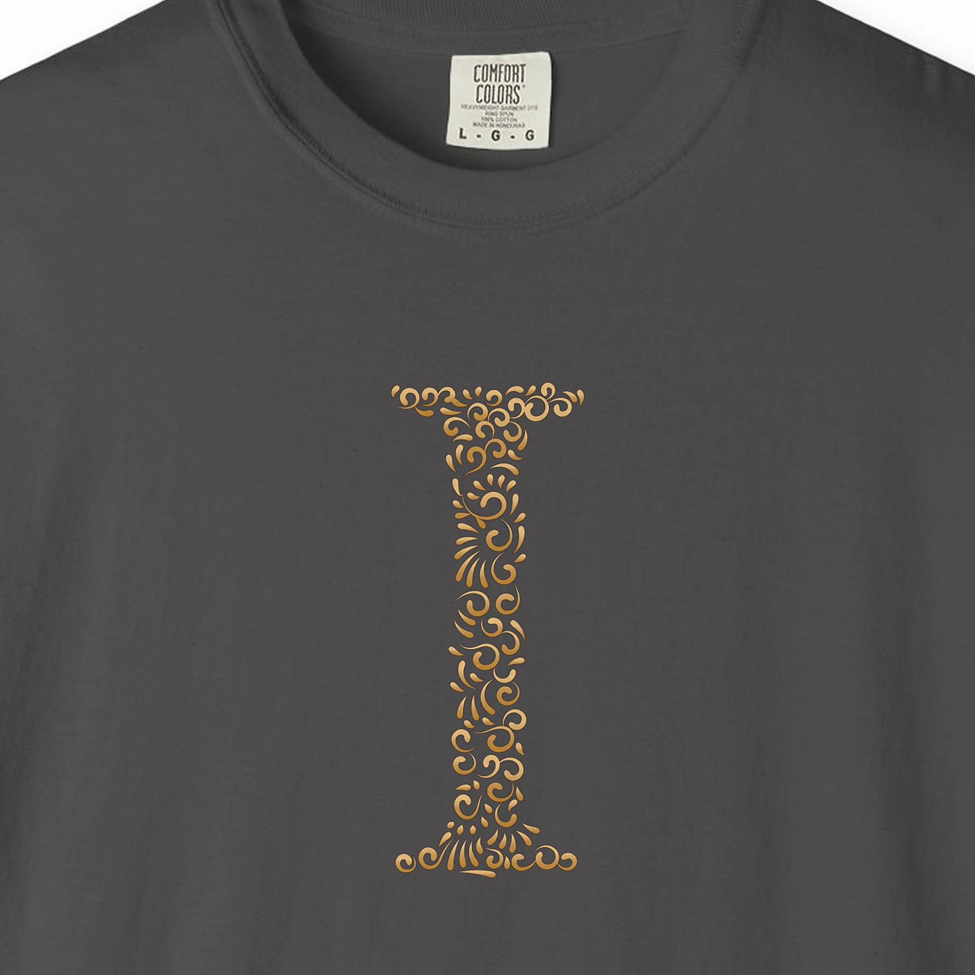 Close-up of the Initial I print on a Graphite Comfort Colors 1717 tee