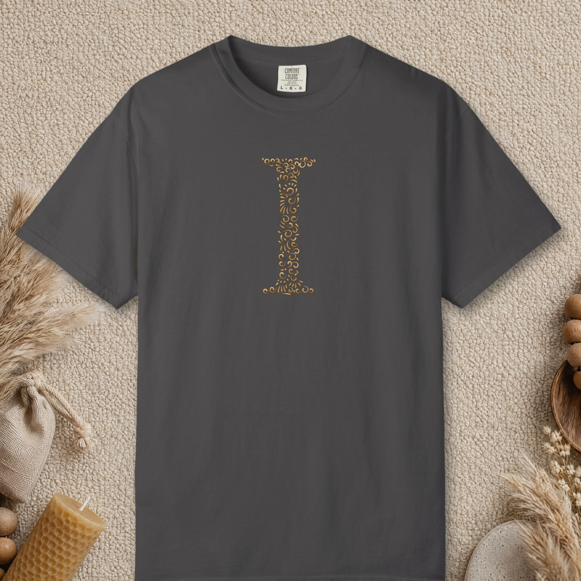 Initial I design on a Graphite Comfort Colors 1717 tee, laid flat