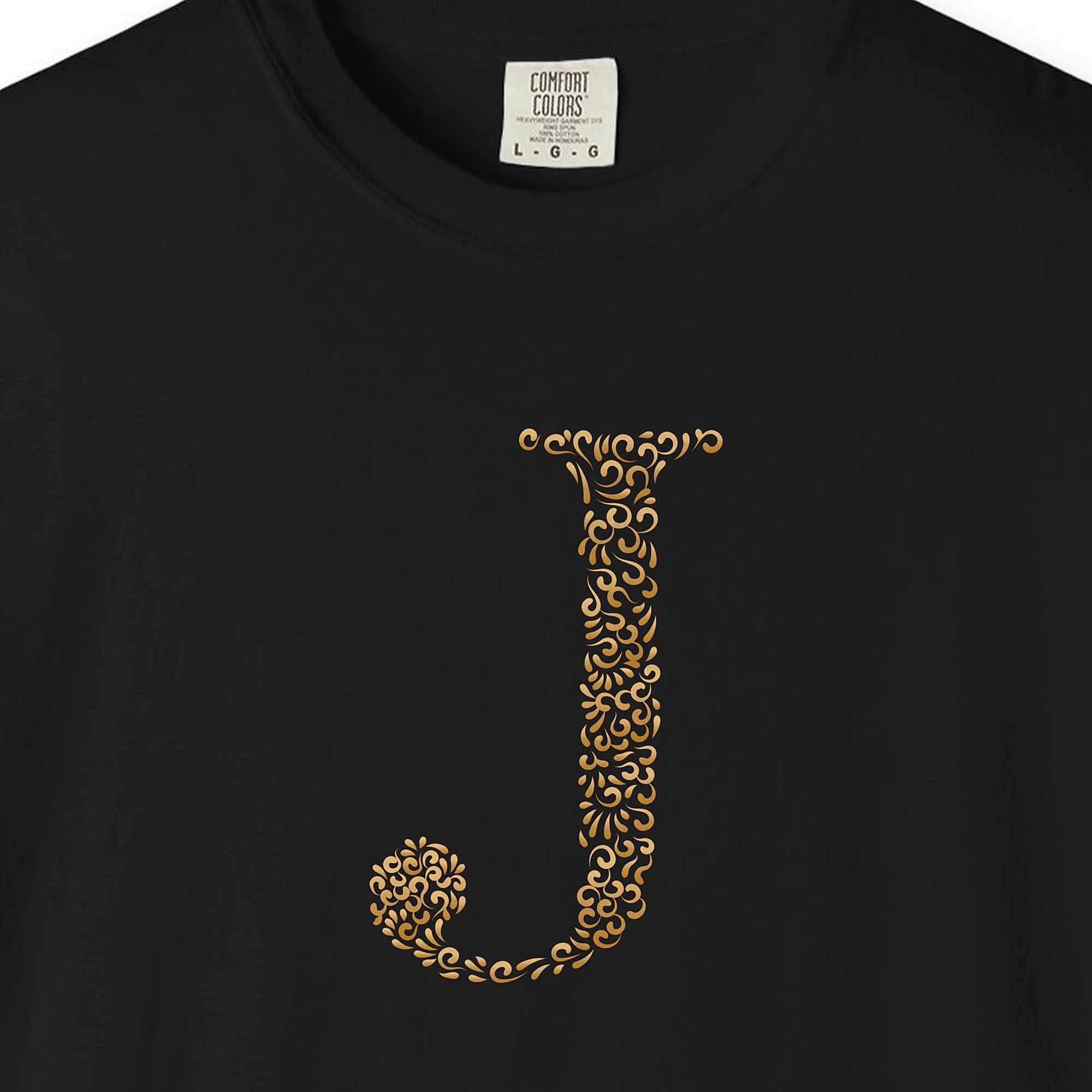 Close-up of the Initial J print on a Black Comfort Colors 1717 tee
