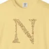 initial-n-tee-butter-chest Close-up of the Initial N print on a Butter Comfort Colors 1717 tee