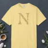 initial-n-tee-butter-front Initial N design on a Butter Comfort Colors 1717 tee, laid flat
