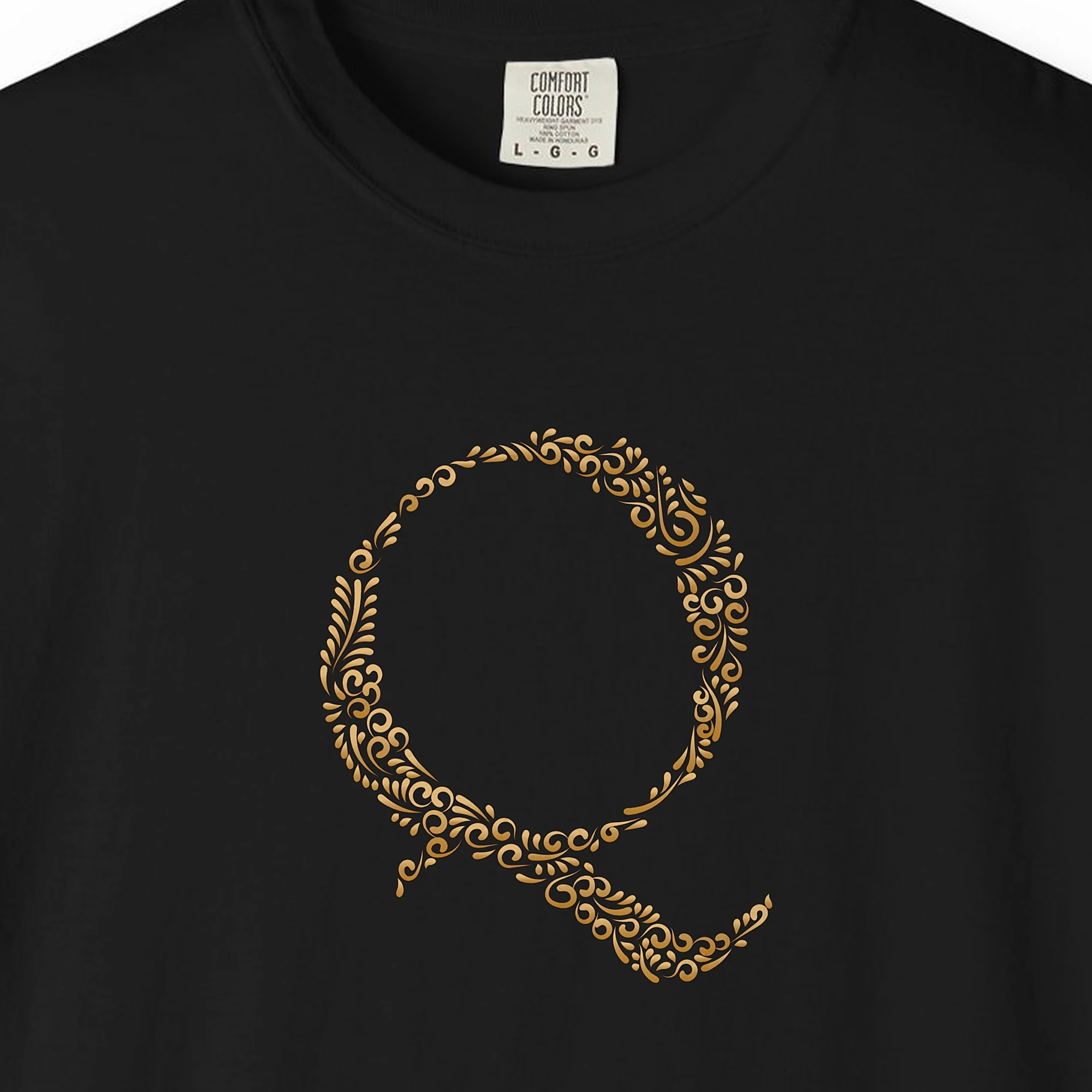 Close-up of the Initial Q print on a Black Comfort Colors 1717 tee