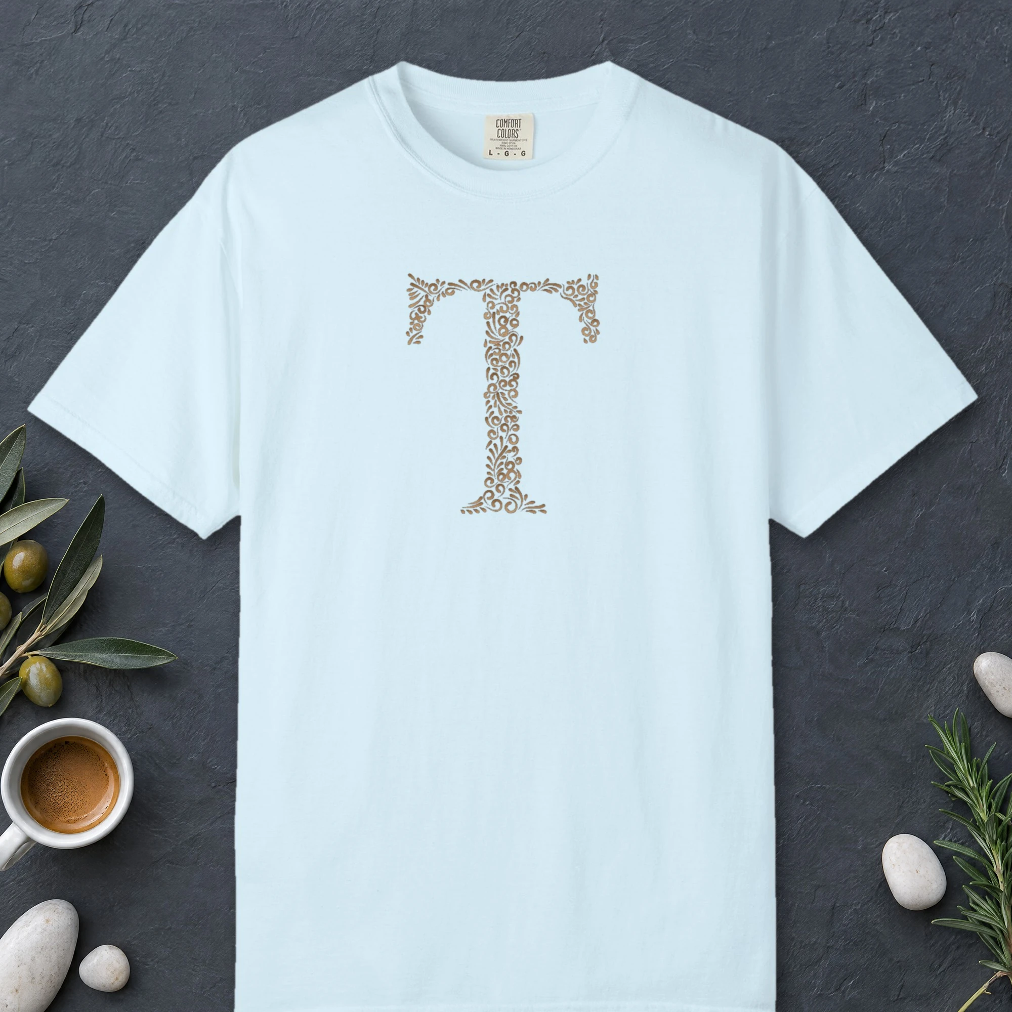 Initial T design on a Chambray Comfort Colors 1717 tee, laid flat