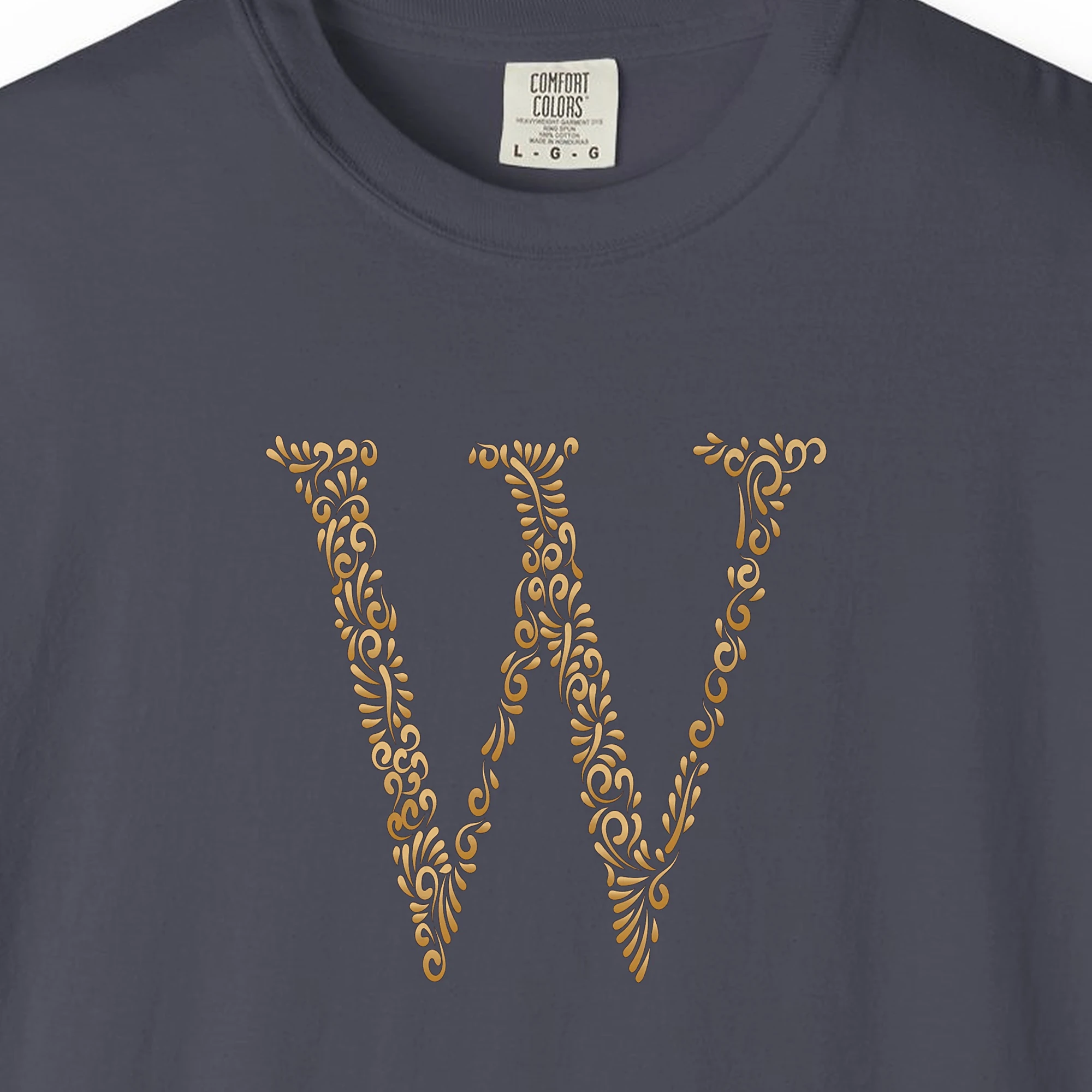 Close-up of the Initial W print on a Navy Comfort Colors 1717 tee