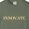 Close-up of the Innovate print on a Moss Comfort Colors 1717 tee