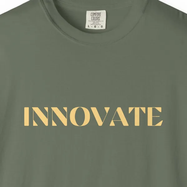 Close-up of the Innovate print on a Moss Comfort Colors 1717 tee